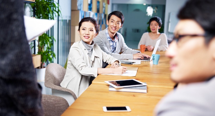 Asian business people listening to a presentation 