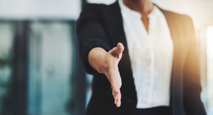 Mature female businesses woman shaking hands 