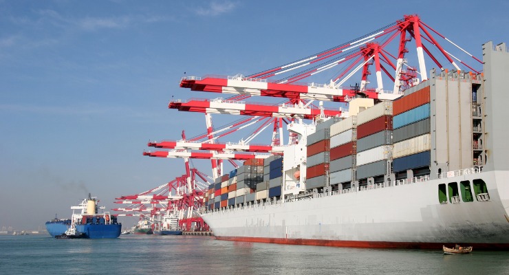 Cargo ship docked holding sea containers 