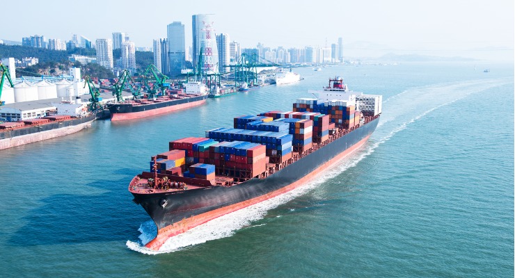 A container ship leaving a chinese port with containers shipping from China to Australia.